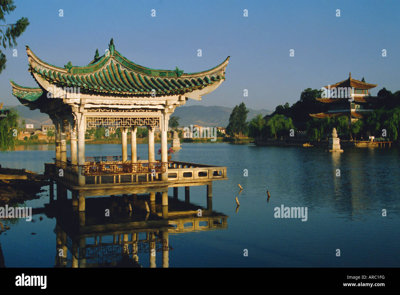 Pavilion and lake in a park, Kunming, Yunnan Province, China Stock Photo