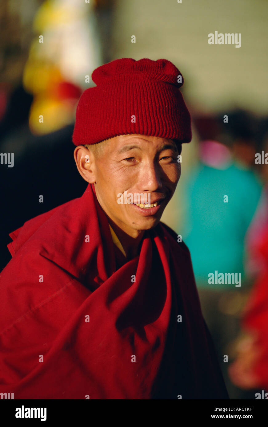 Portrait of a man in red, Lhasa, Tibet, China, Asia Stock Photo