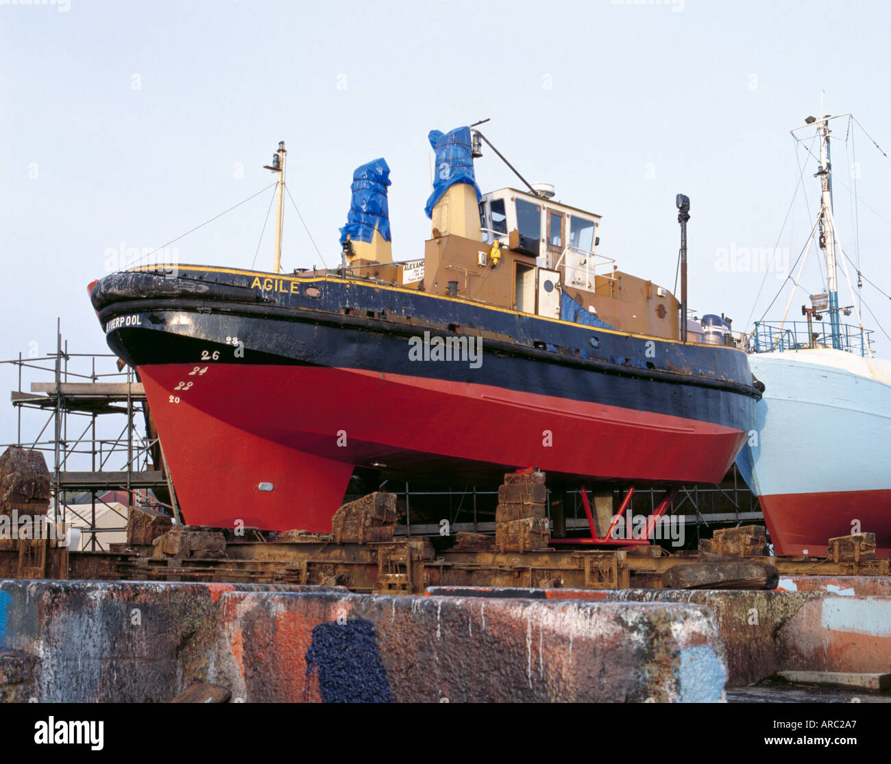 A tug with a Voith Schneider propulsion unit, in a ship repair yard, Grimsby, Humberside, North Lincolnshire, England, UK. Stock Photo