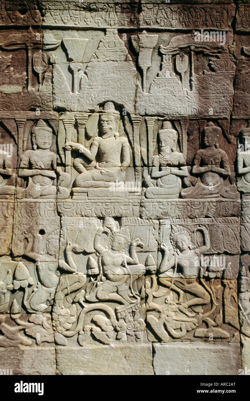 Stone bas-reliefs depicting scenes of rural life and historical events, in the Bayon Temple complex, Angkor, Siem Reap, Cambodia Stock Photo