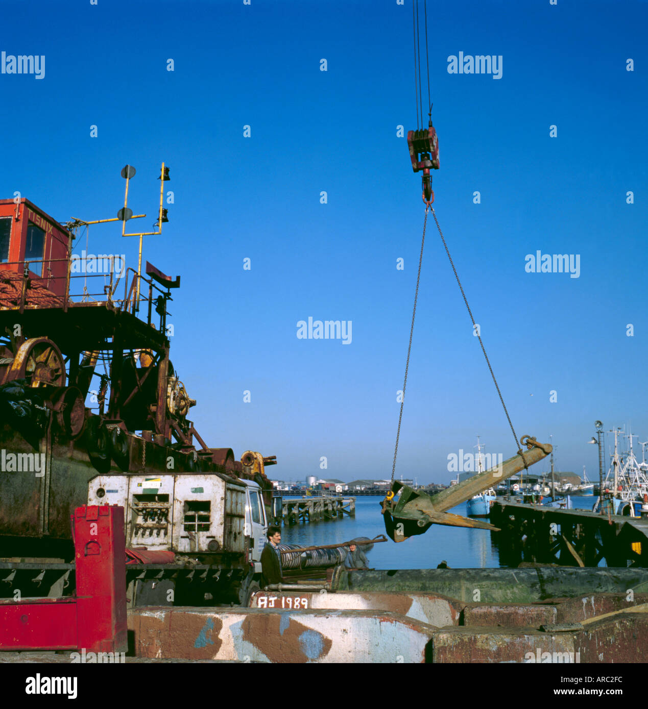 Crane lifting an anchor, ship repair yard, Grimsby, Humberside, England
