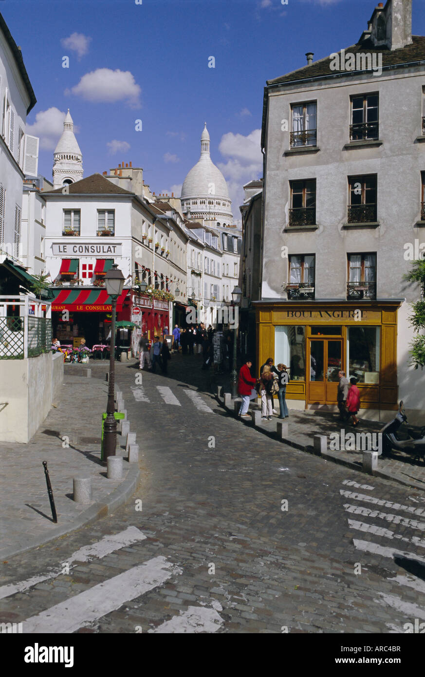 Street scene and the dome of the basilica of Sacre Coeur, Montmartre, Paris, France, Europe Stock Photo