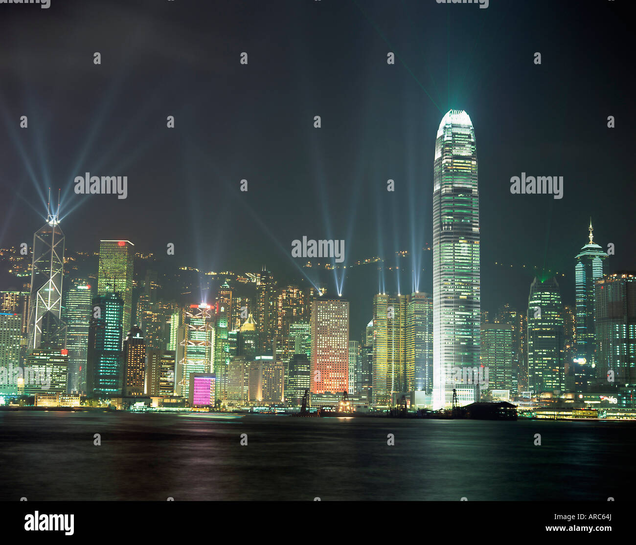 Hong Kong city skyline looking across Victoria harbour to Hong Kong Island at night, Hong Kong, China, Asia Stock Photo