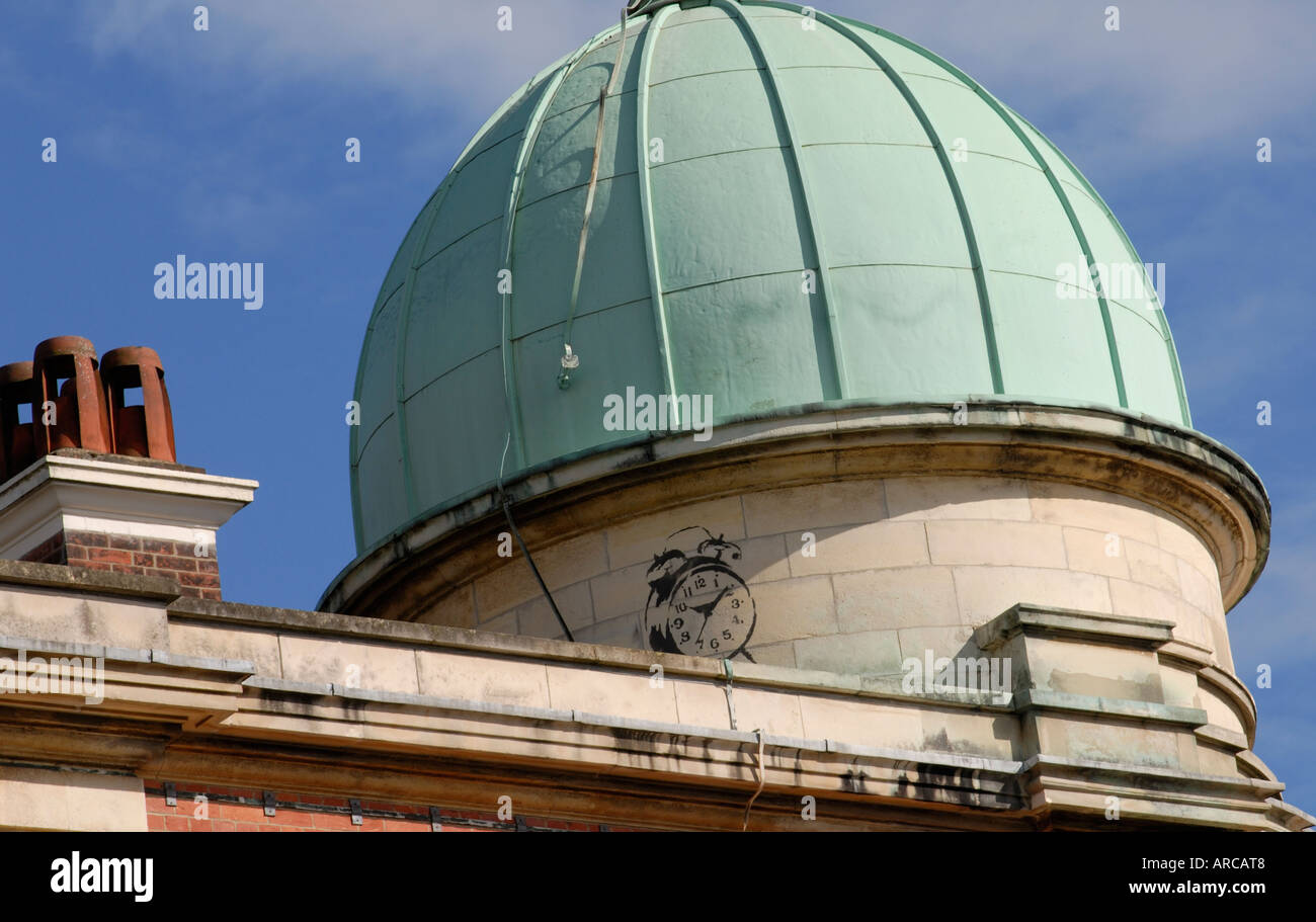 Stenciled graffito of a traditional alarm clock with bells Stock Photo