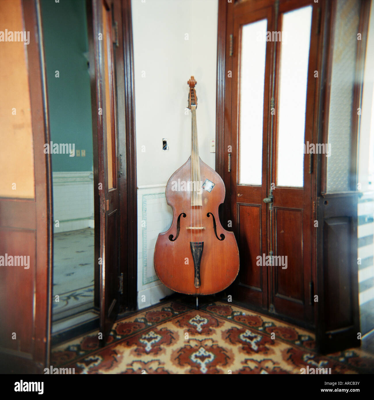 Double bass propped against a wall, Cienfuegos, Cuba, West Indies, Central America Stock Photo