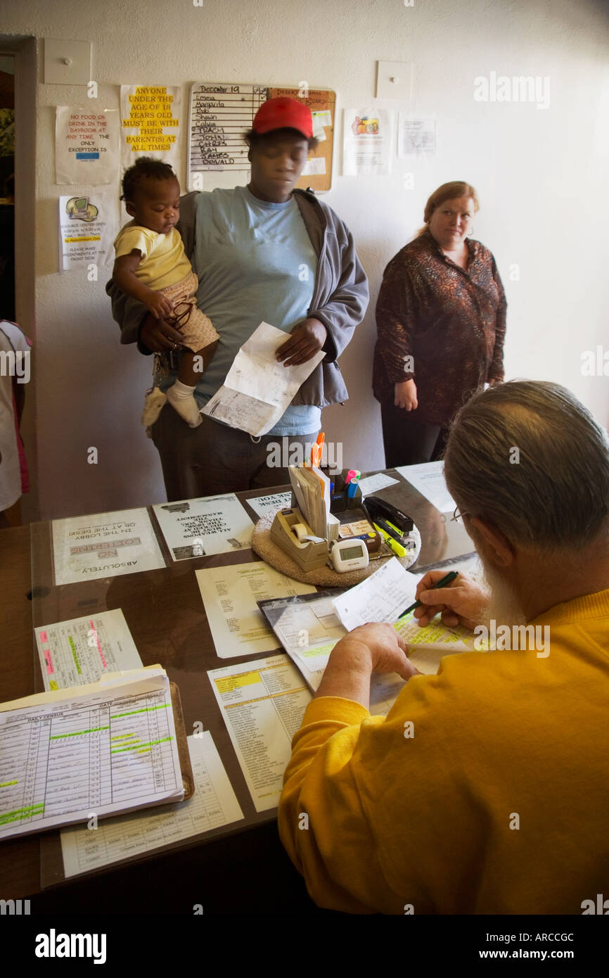 A woman and her child arrive for a free Christmas dinner at the front