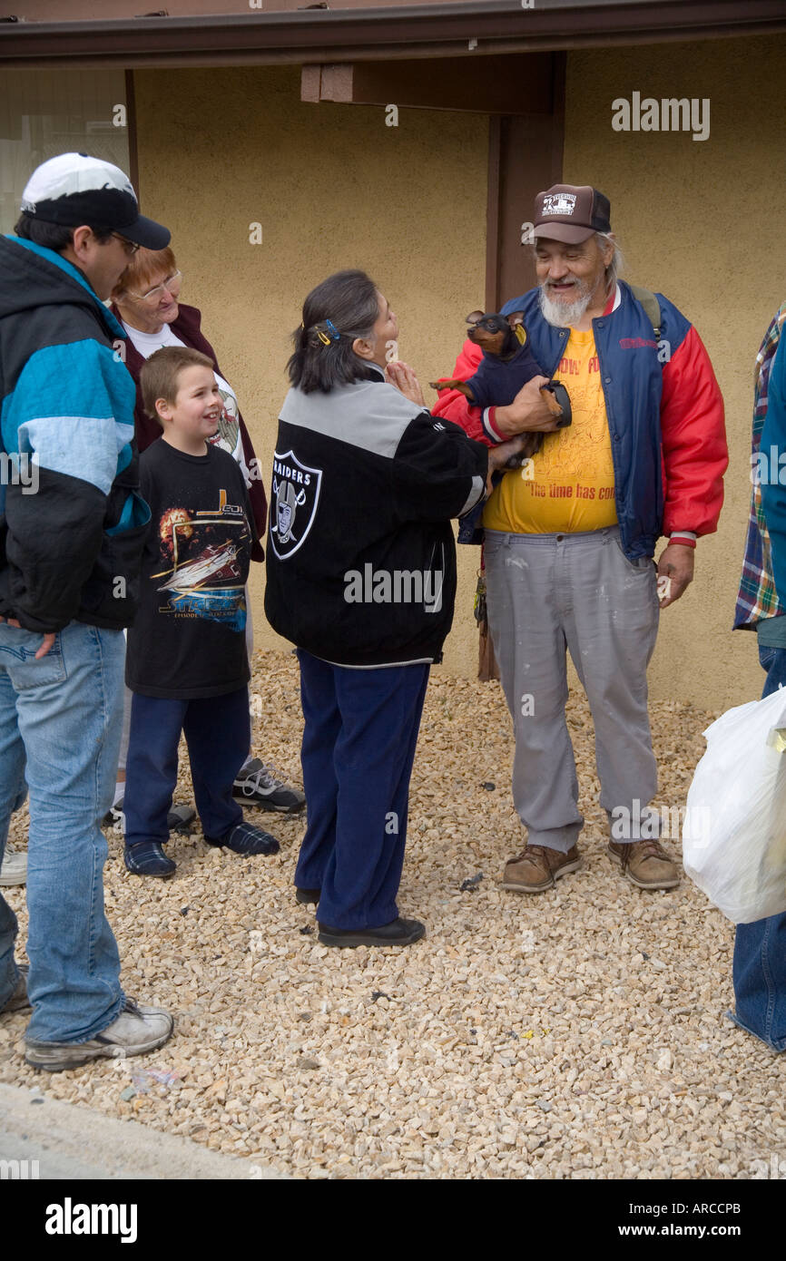 As low and homeless people in Barstow CA line up at a homeless