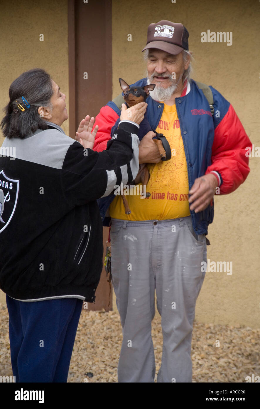 As low and homeless people in Barstow CA line up at a homeless