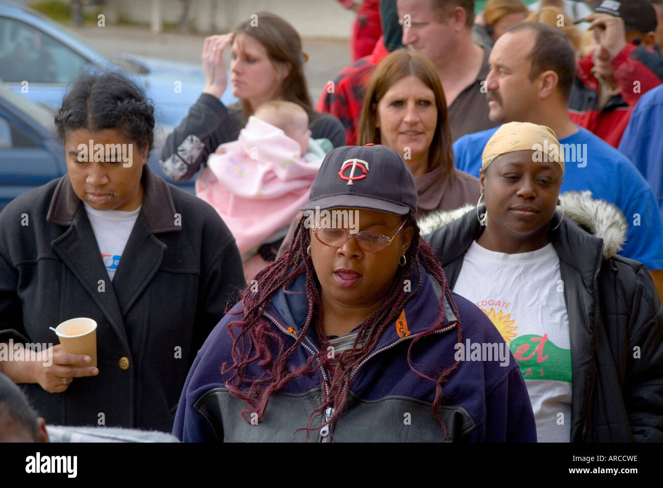 Low and homeless people in Barstow CA line up at a homeless