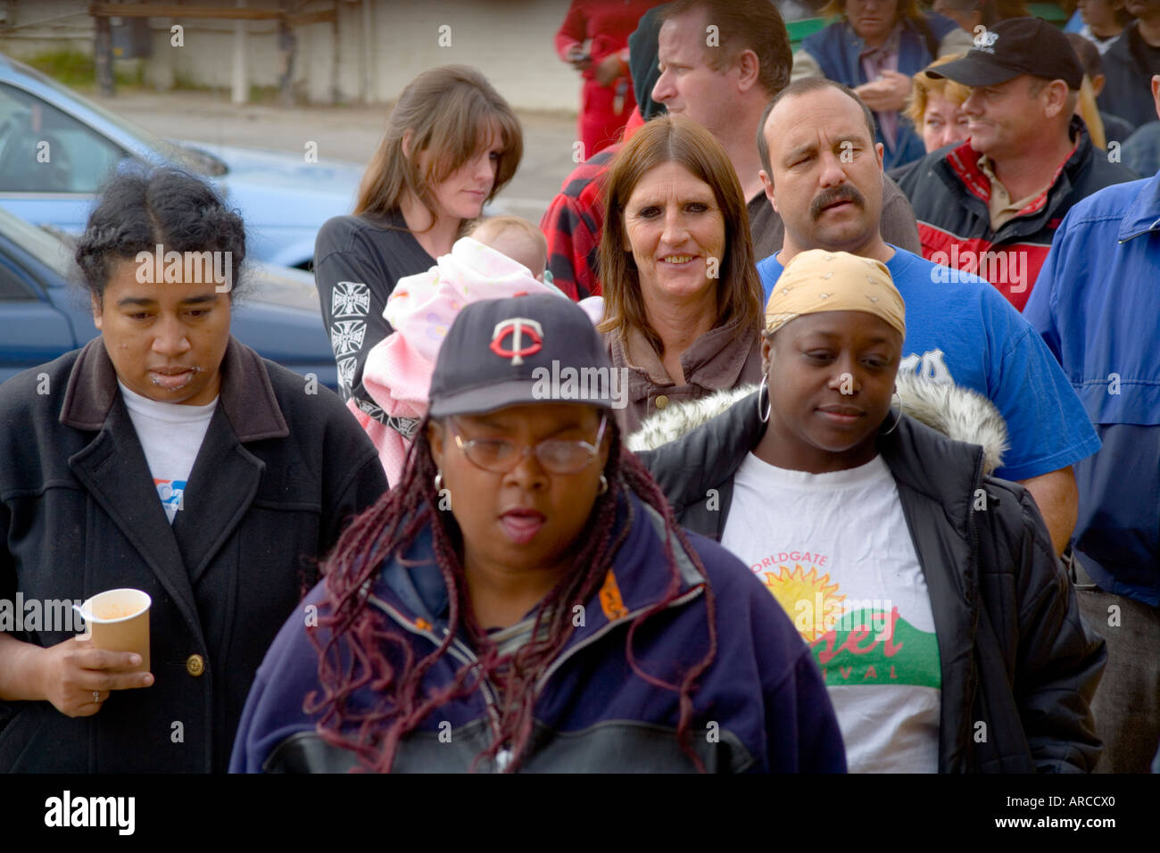 Low and homeless people in Barstow CA line up at a homeless
