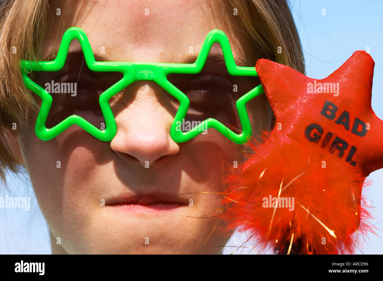 Bad Girl Little spoiled tearaway poses with sunglasses Stock Photo