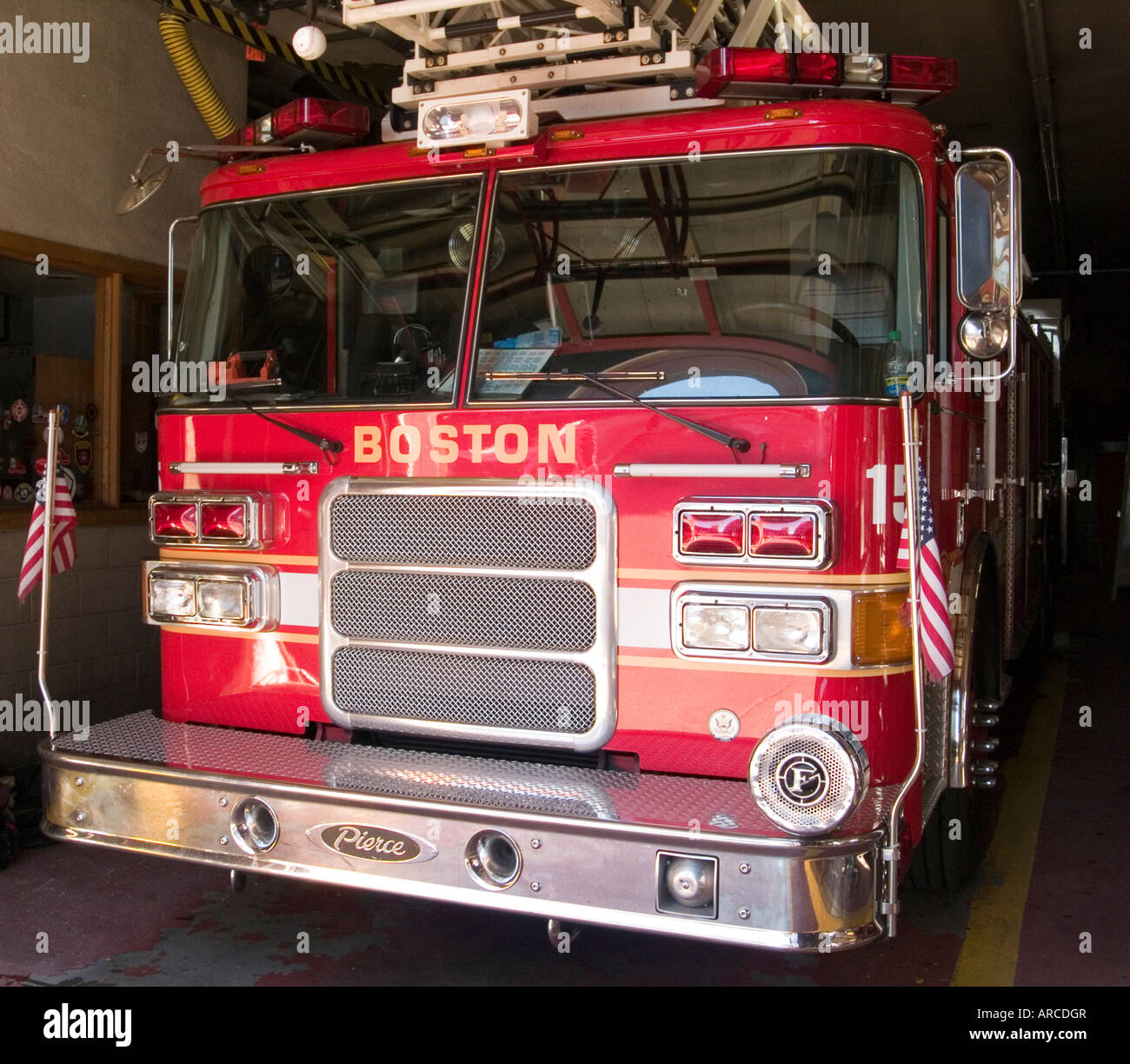 A bright red fire engine parked in a station in downtown Boston, Massachusetts USA Stock Photo
