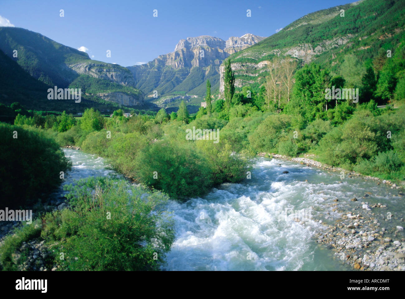 Torla, the River Ara and distant Mondarruego, Huesca (Pyrenees), Aragon, Spain, Europe Stock Photo