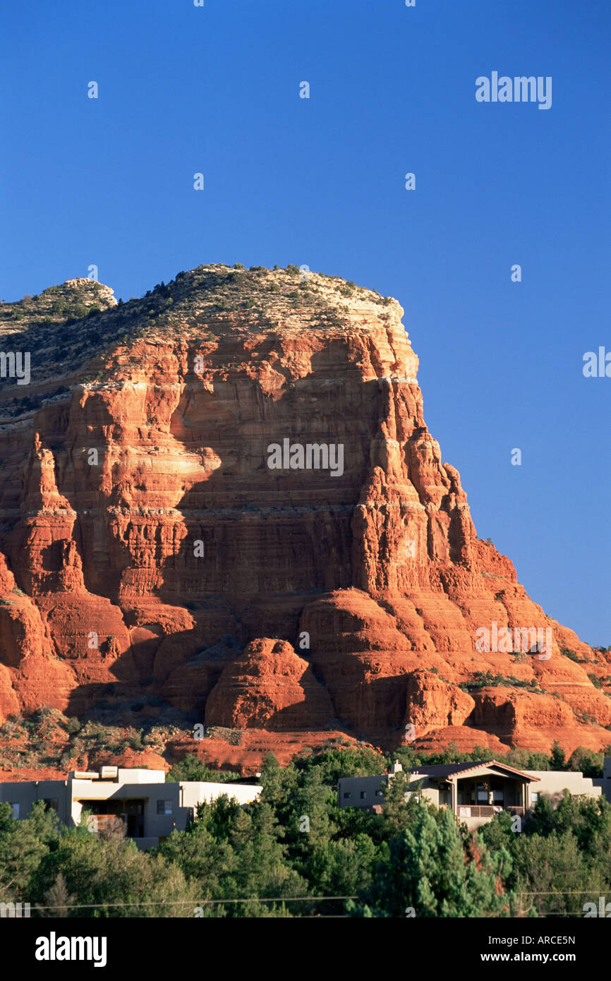 Courthouse Butte towering above prestigious properties, in early morning light, Sedona, Arizona, USA (U.S.A.), North America Stock Photo