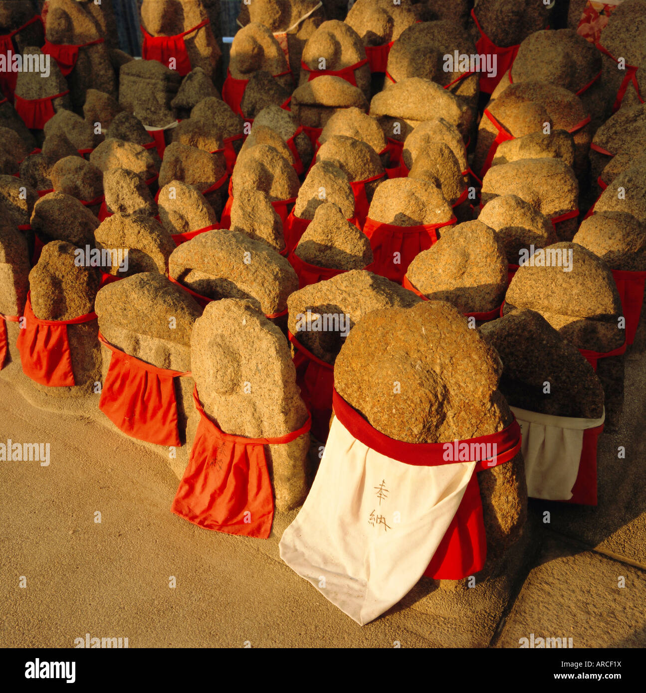 Jizo statues, memorials to children who have died at birth, Kyoto, Kansai, Japan Stock Photo