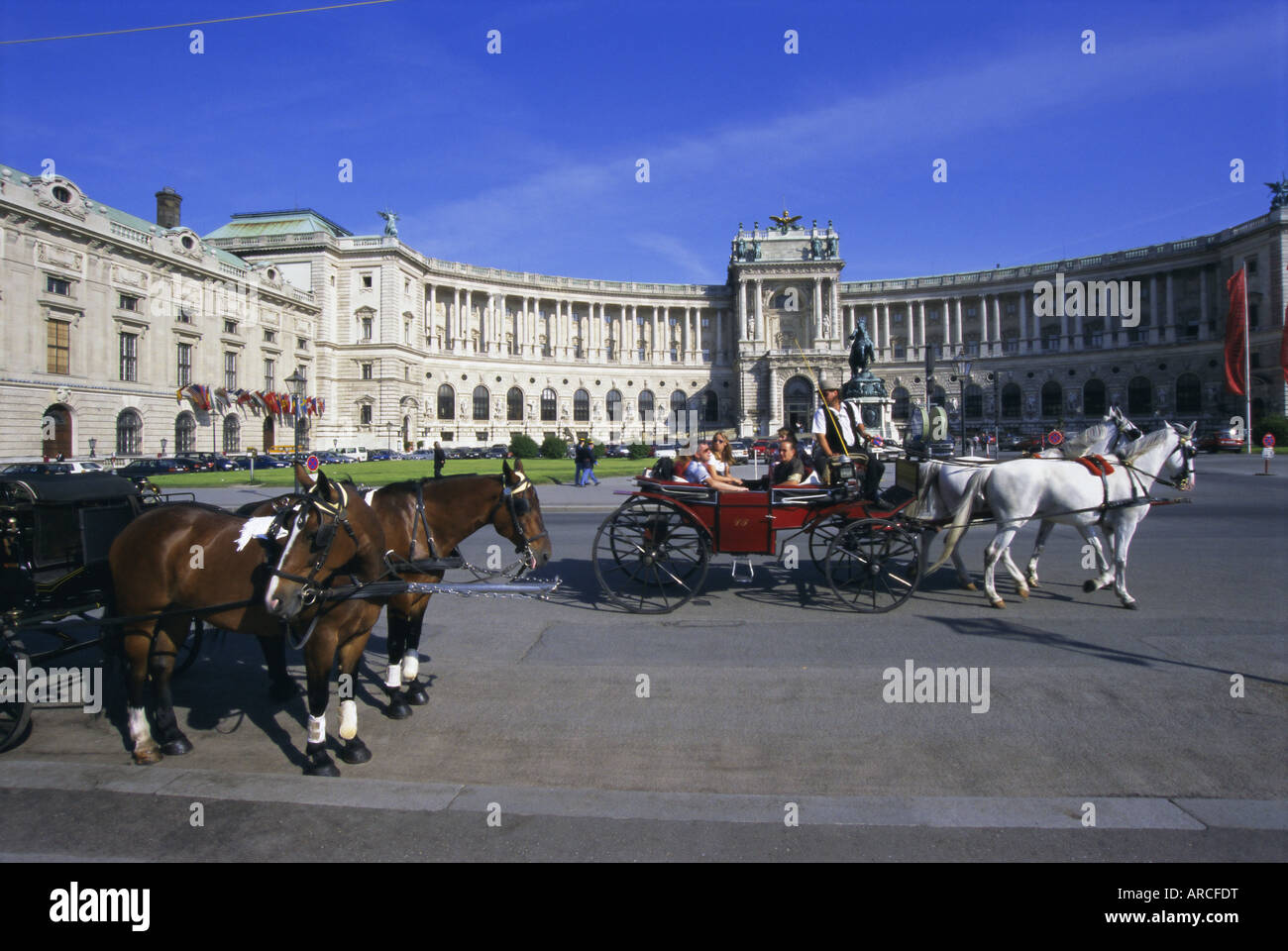 Neue Hofburg and fiaker (horse drawn carriages), Vienna, Austria, Europe Stock Photo