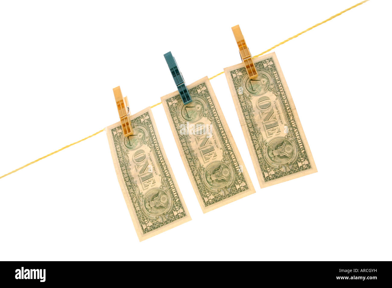 dollars on a clothesline; isolated on white background Stock Photo