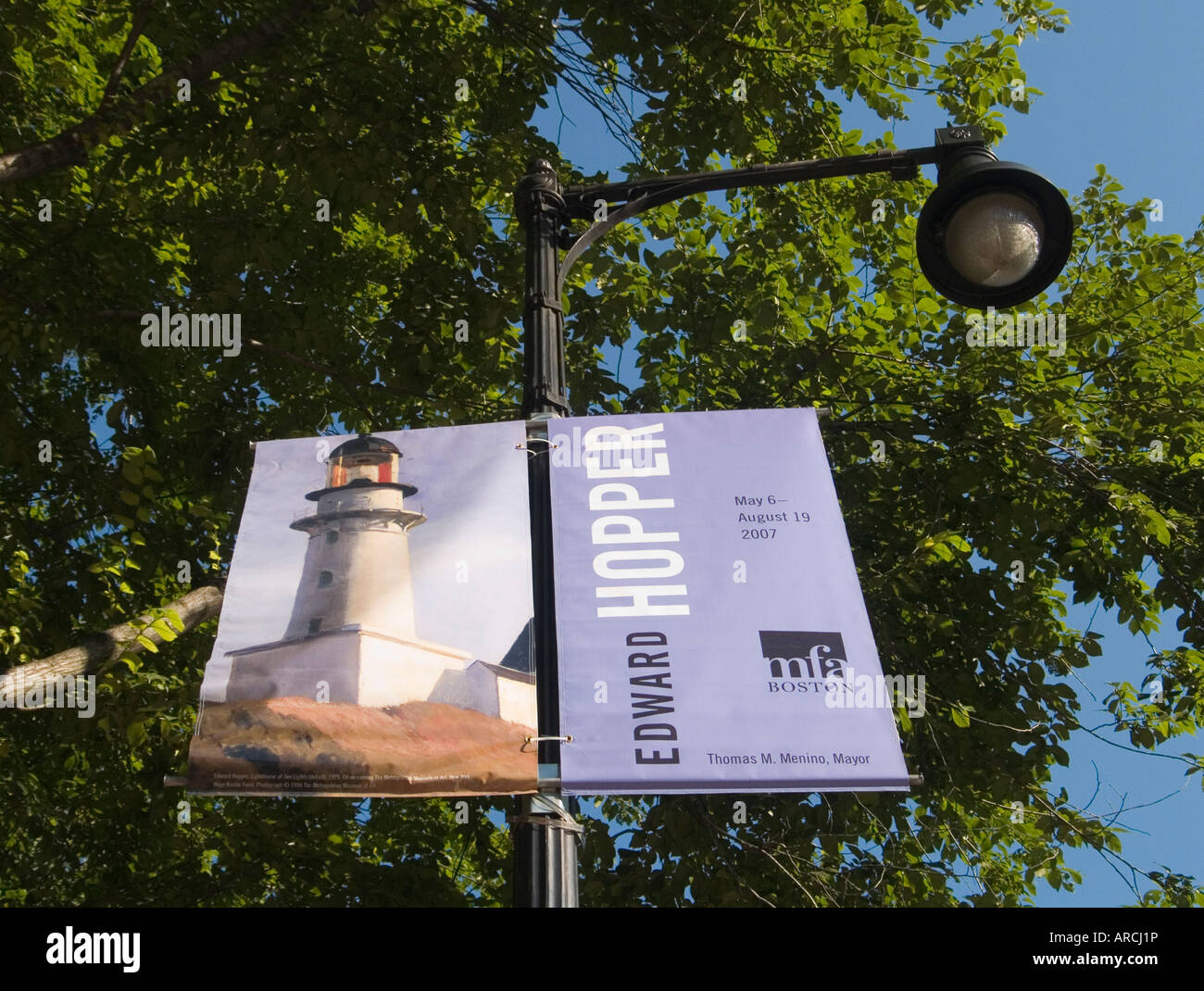 A banner on a street light advertising an Edward Hopper Exhibition at