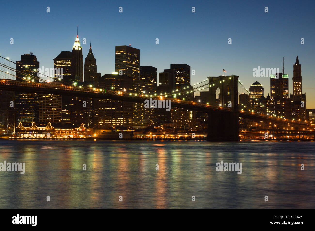Manhattan skyline and Brooklyn Bridge at dusk, New York City, New York ...