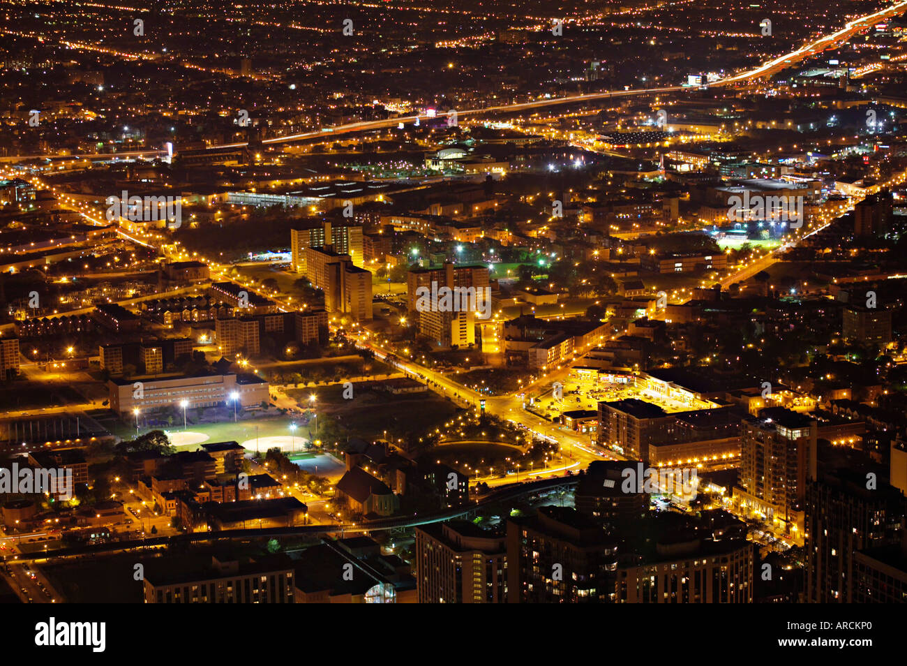 NIGHT Chicago Illinois Views of city at night from the Hancock Observatory streets and roads baseball diamonds under lights Stock Photo