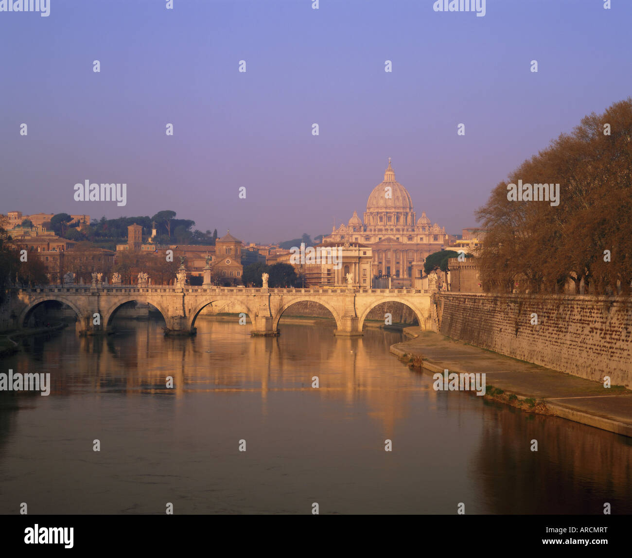 Dome of St. Peters and skyline of the Vatican above the Tiber River