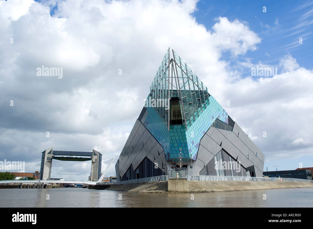 The Deep, marine life tourist attraction in Kingston Upon Hull. Shot from river Humber, also showing the Tidal Flood Barrier. Stock Photo