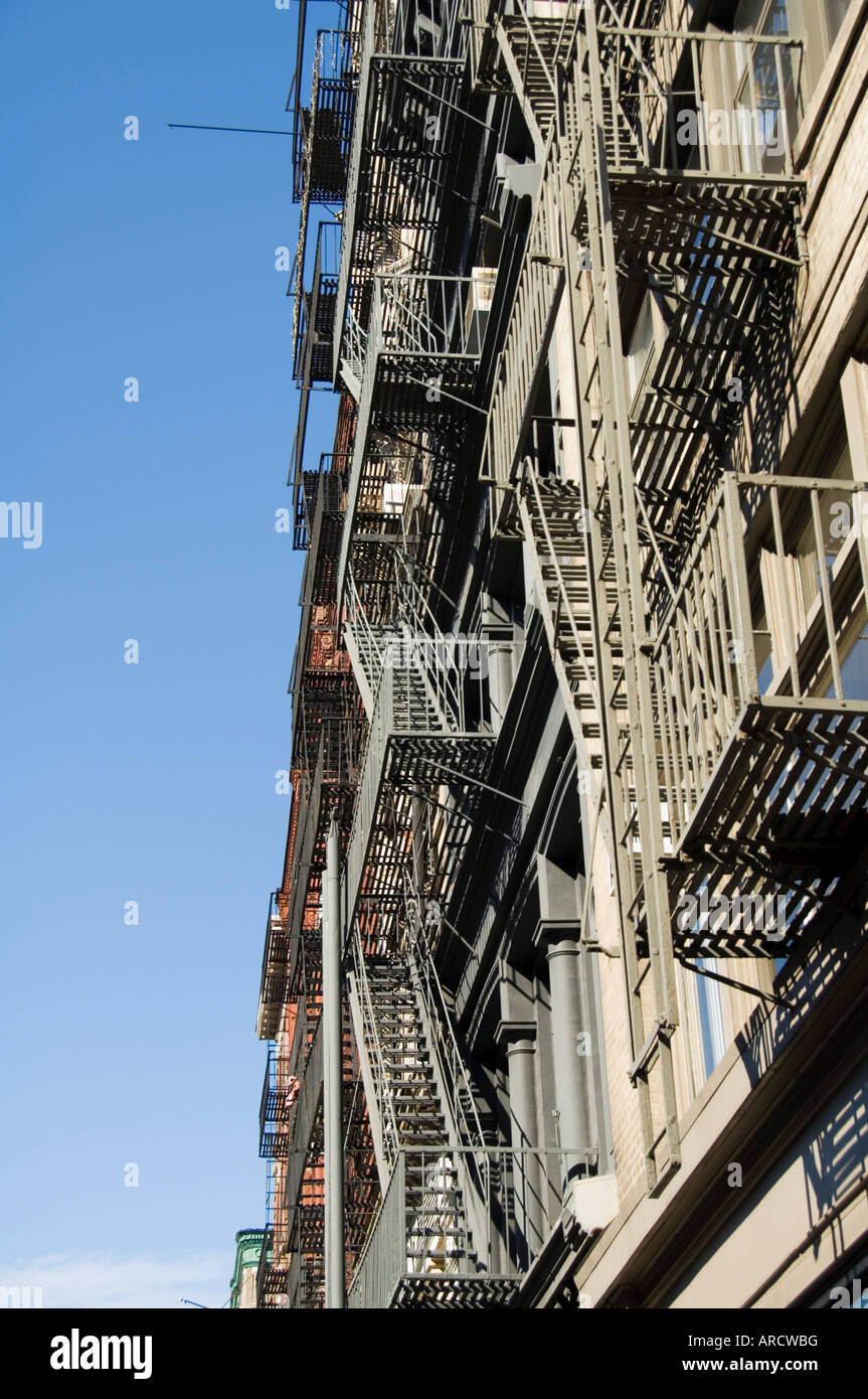 Fire escapes on the outside of buildings in Spring Street, Soho, Manhattan, New York City, New York, USA, North America Stock Photo