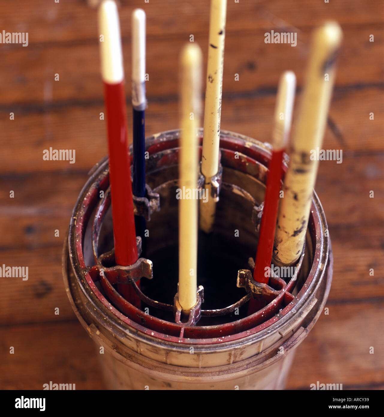 paint brushes hanging upside down in a pot Stock Photo Alamy