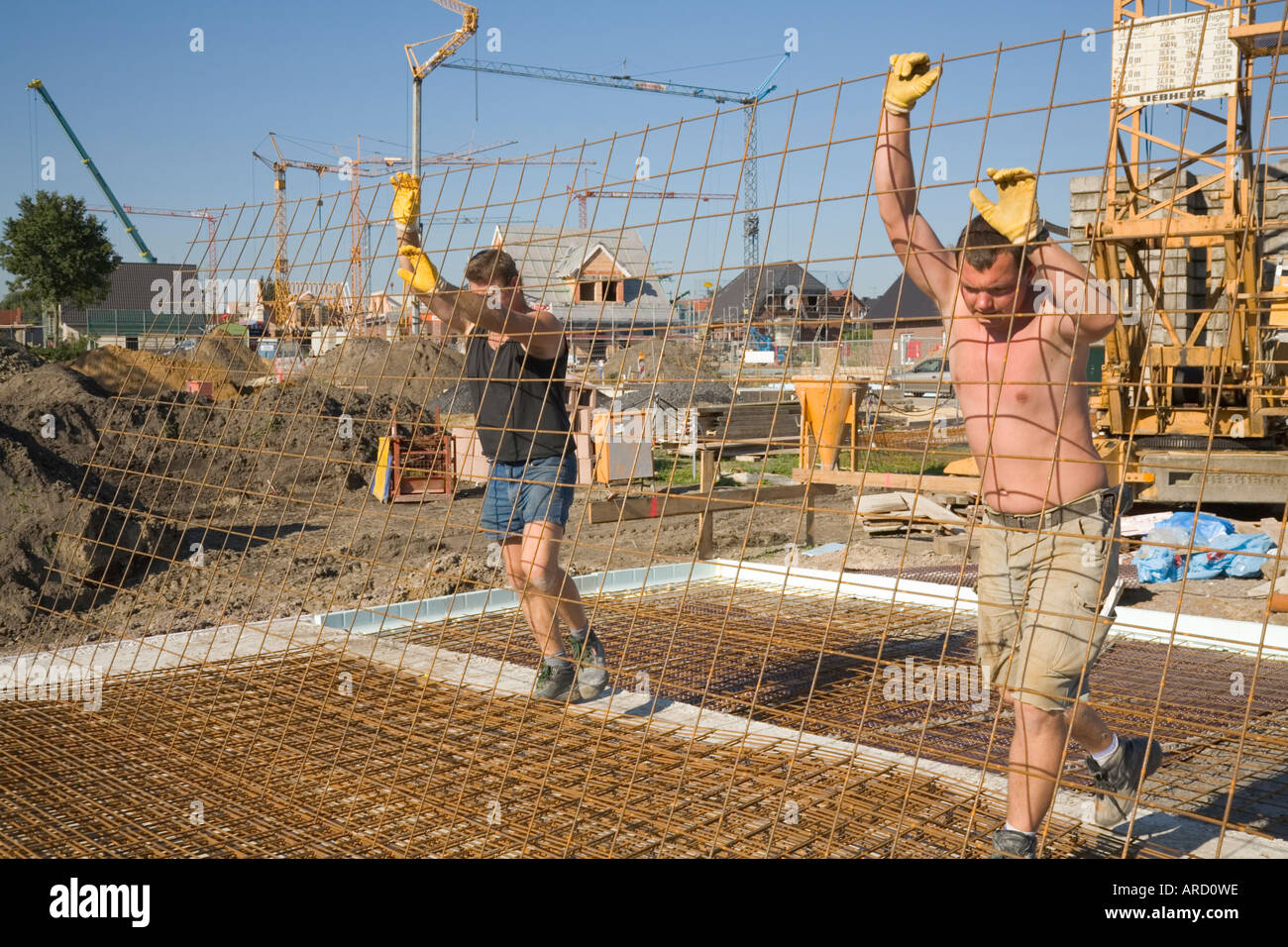 Building labourers at work on a construction site Stock Photo Alamy