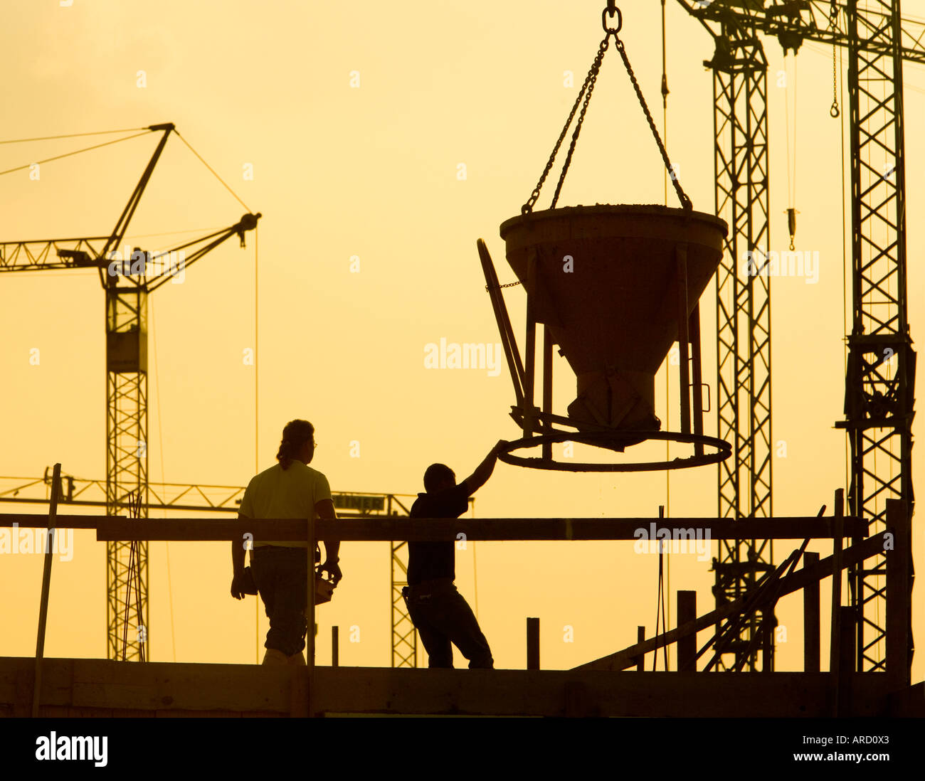 Building labourers at work on a construction site Stock Photo - Alamy
