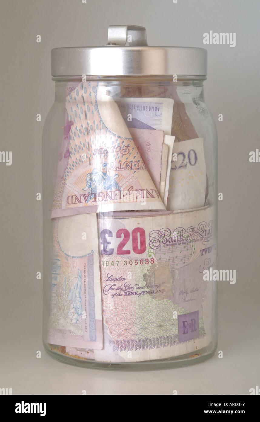 Money jar, pot of money, savings jar Stock Photo