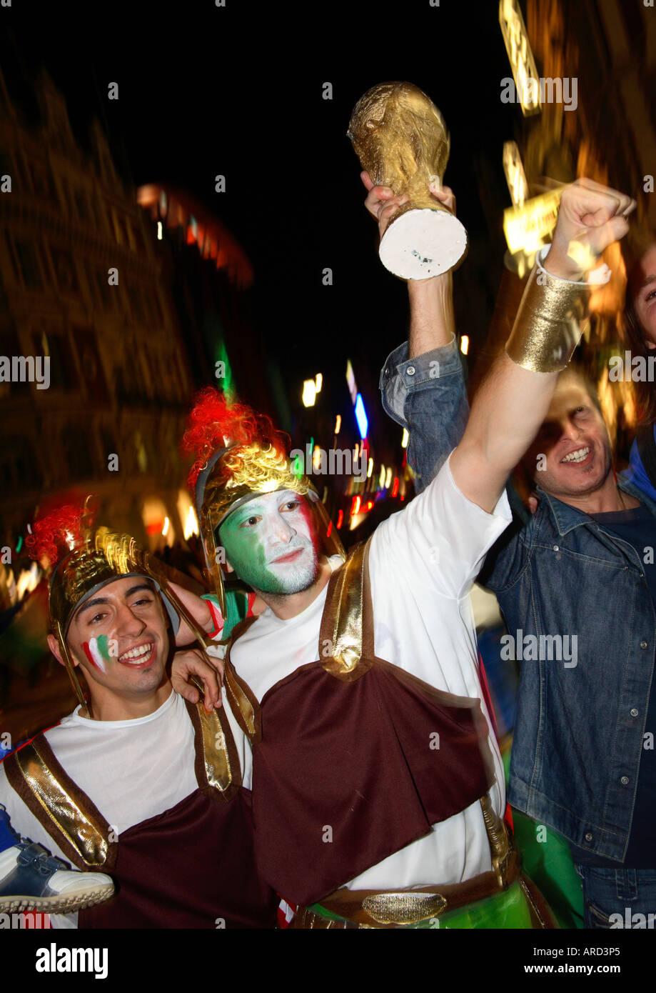 Italian fans dressed as Roman gladiators celebrating in Shaftesbury Avenue after winning 2006 World Cup vs France, Soho, London Stock Photo