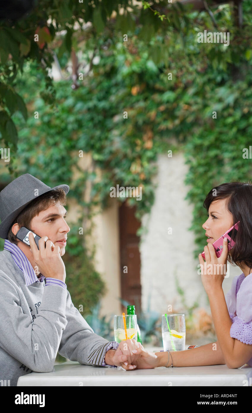 Man and woman holding hands Stock Photo - Alamy