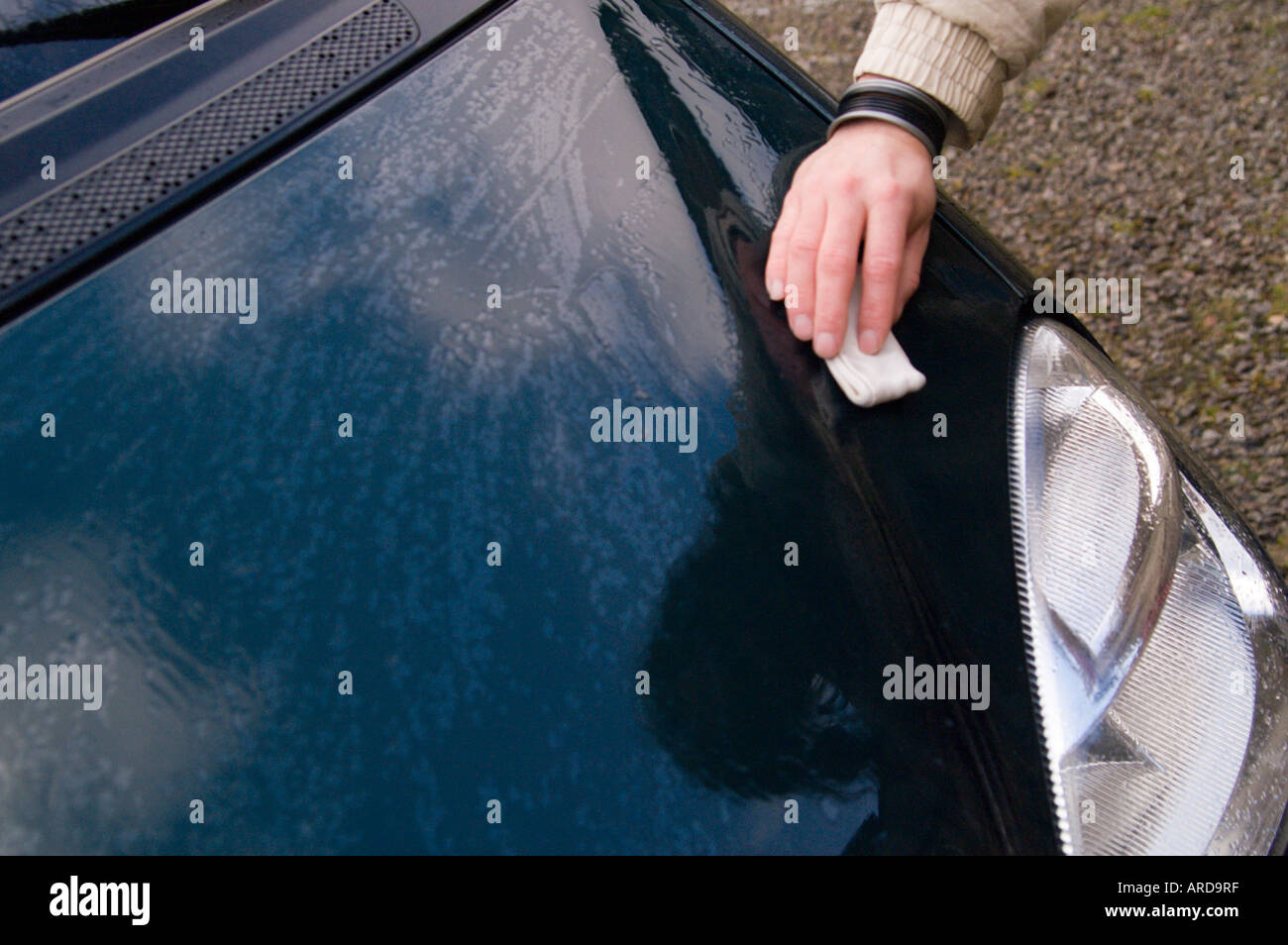 Using a clay compound to clean car paintwork in a process called