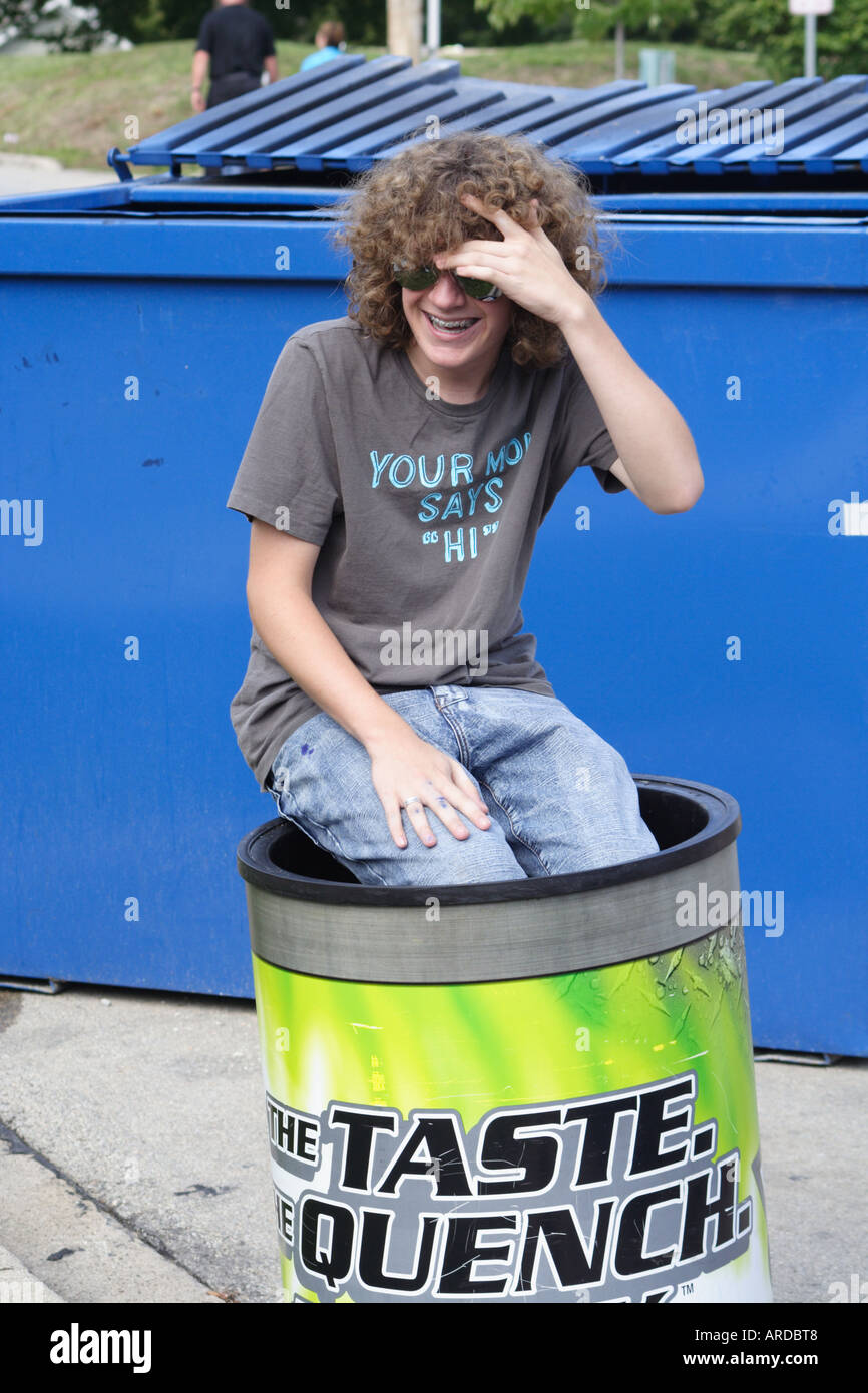 Teenager in a bucket Stock Photo