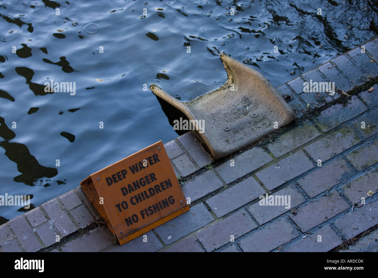 Deep water danger to children no fishing sign next to 'slide' in Barbican complex City of London GB UK Stock Photo