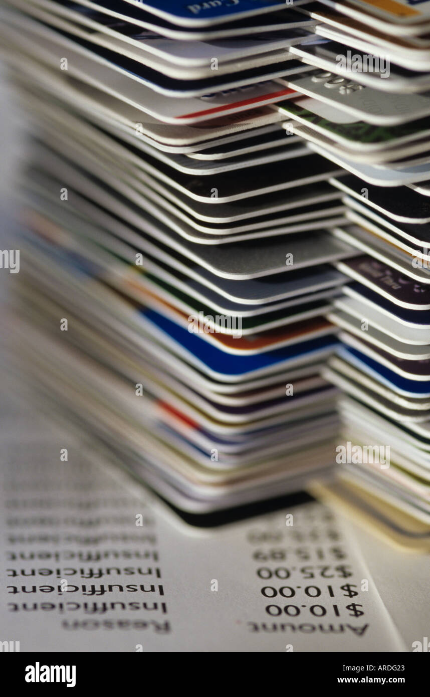 Credit cards stacked on table with past due accounts and insufficient funds Marysville Washington USA Stock Photo