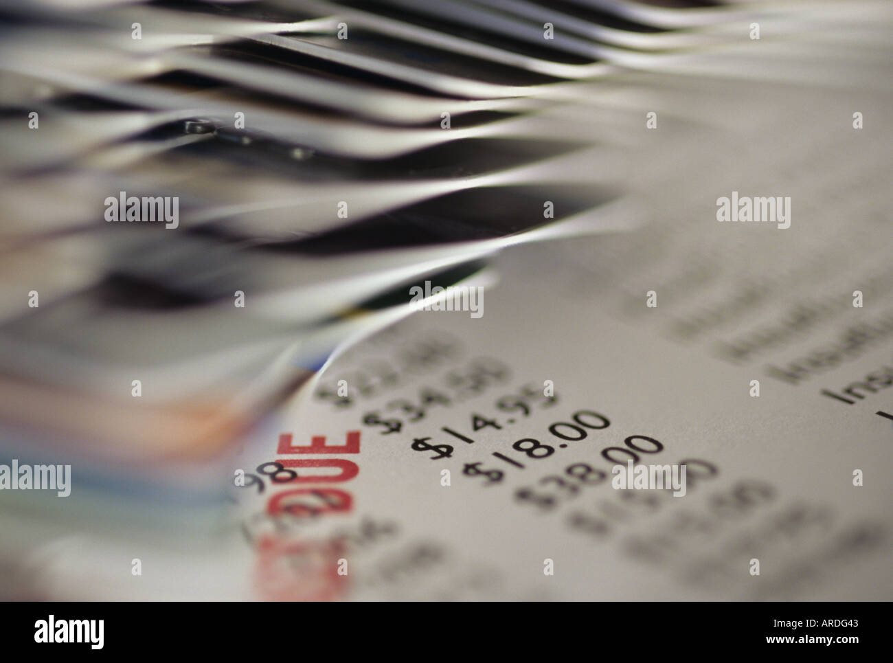 Credit cards stacked on table with past due accounts and insufficient funds Marysville Washington USA Stock Photo