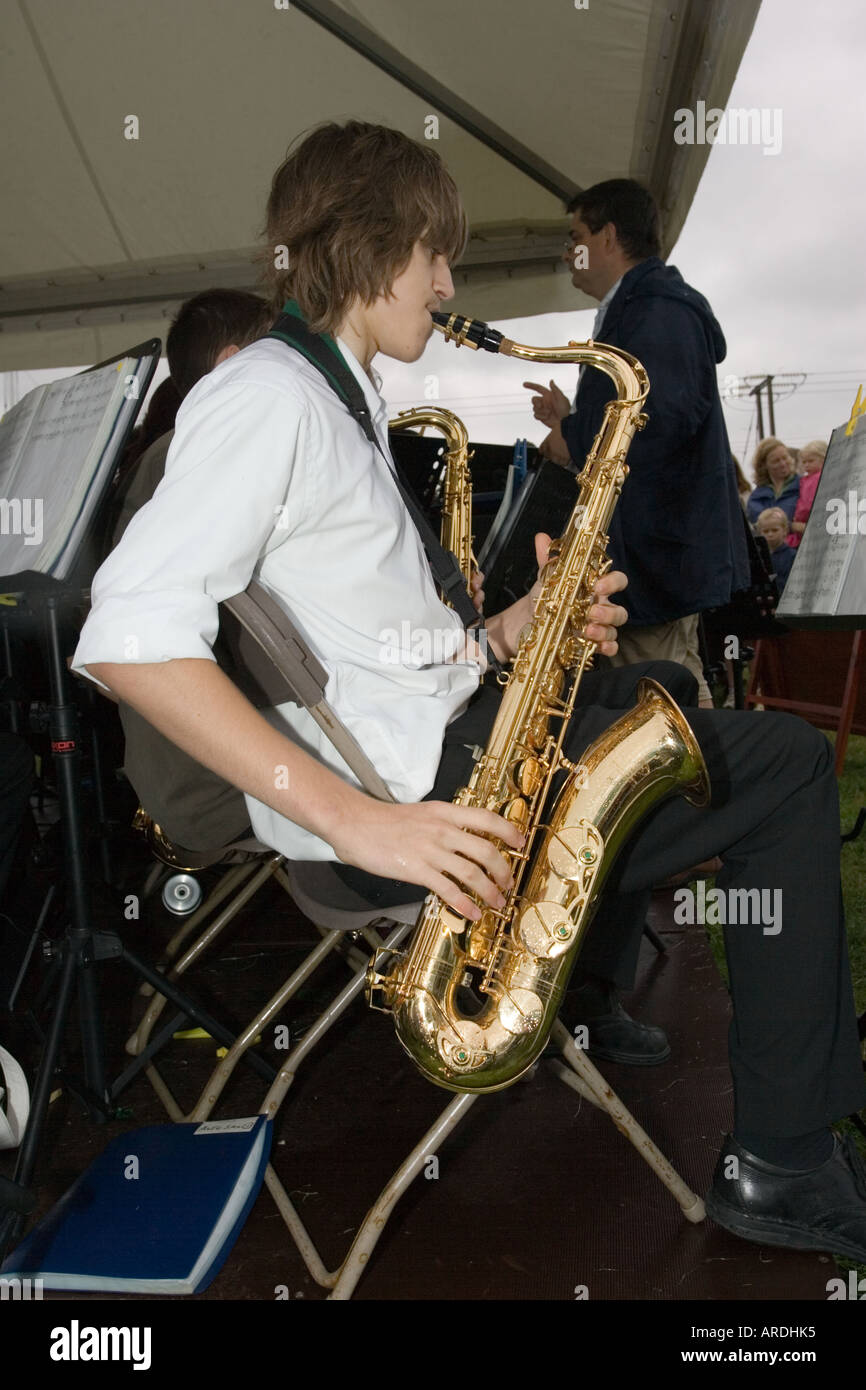 Boy playing saxophone hi-res stock photography and images - Alamy