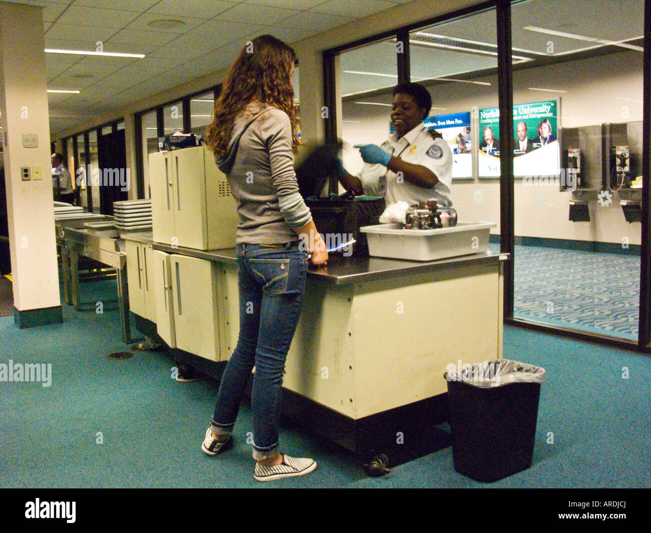 Woman at TSA checkpoint Norfolk International Airport Stock Photo