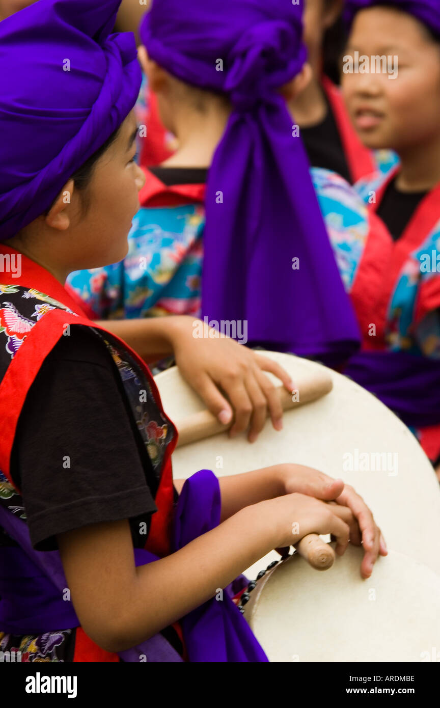 Children prepare to perform in a drumming and dancing summer festival in Shinjuku Tokyo Japan