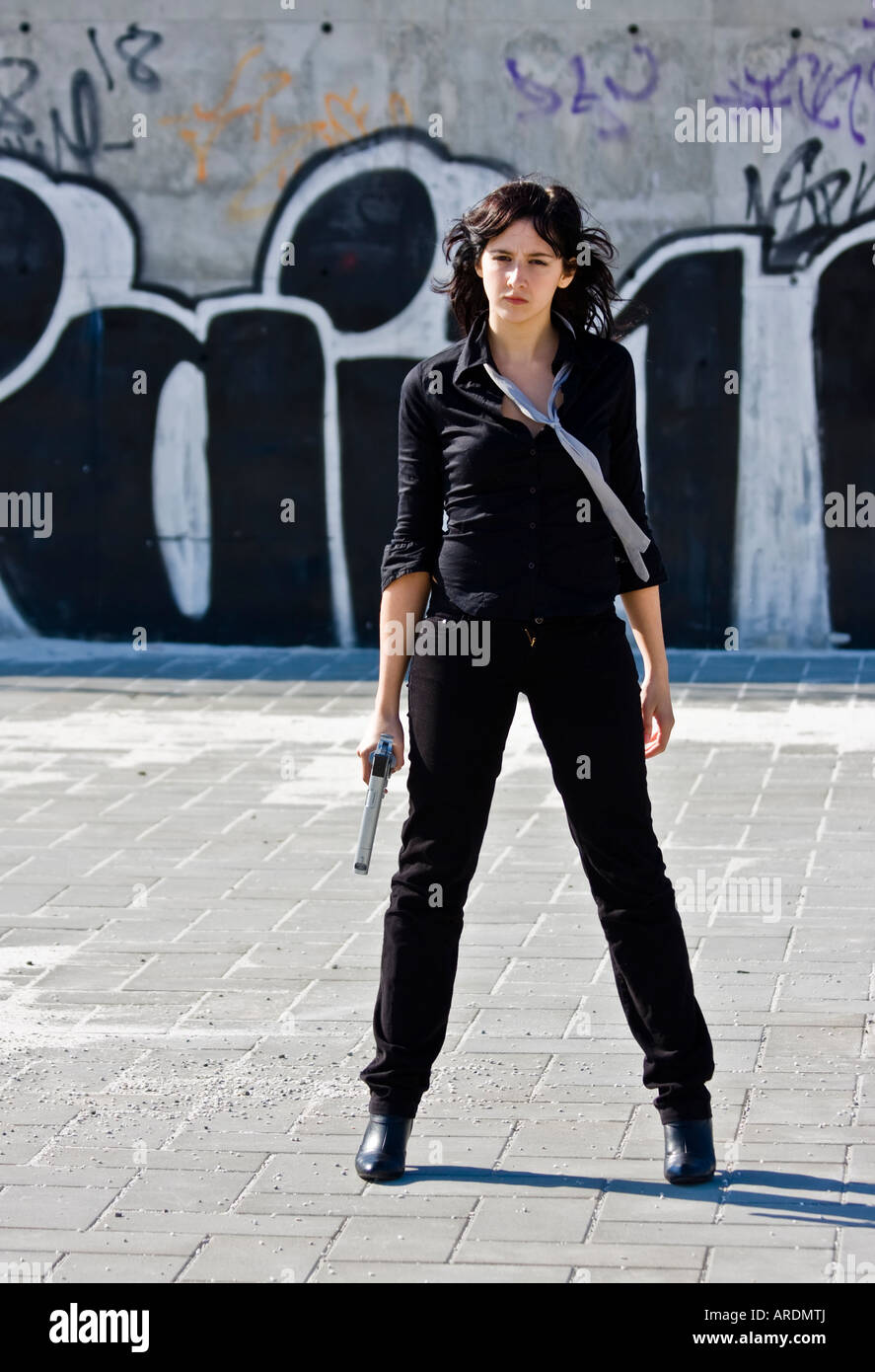 Mafia girl in urban graffiti background Stock Photo - Alamy