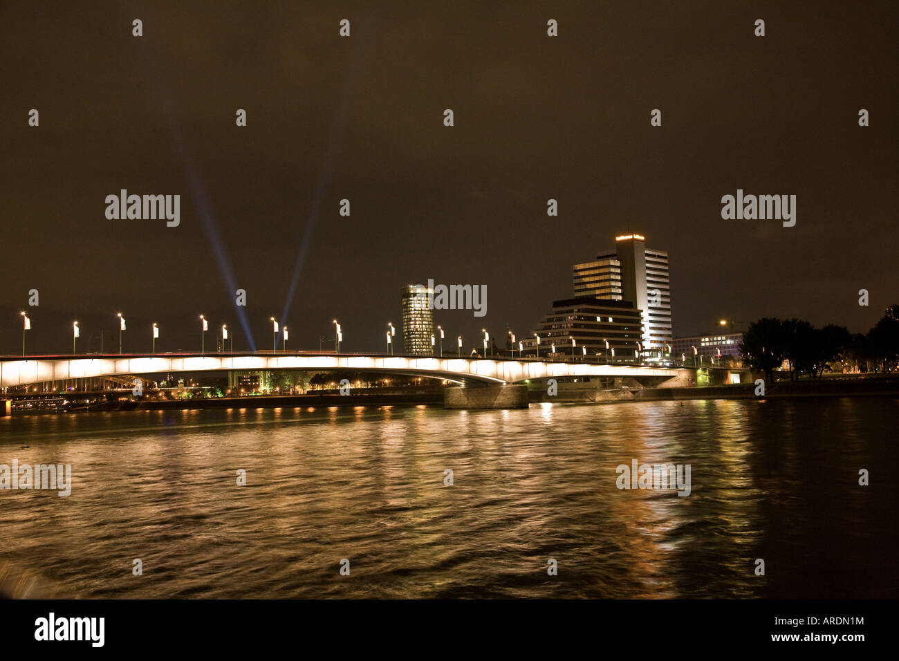 RHINE BRIDGE CROSSING COLOGNE GERMANY AT NIGHT Stock Photo