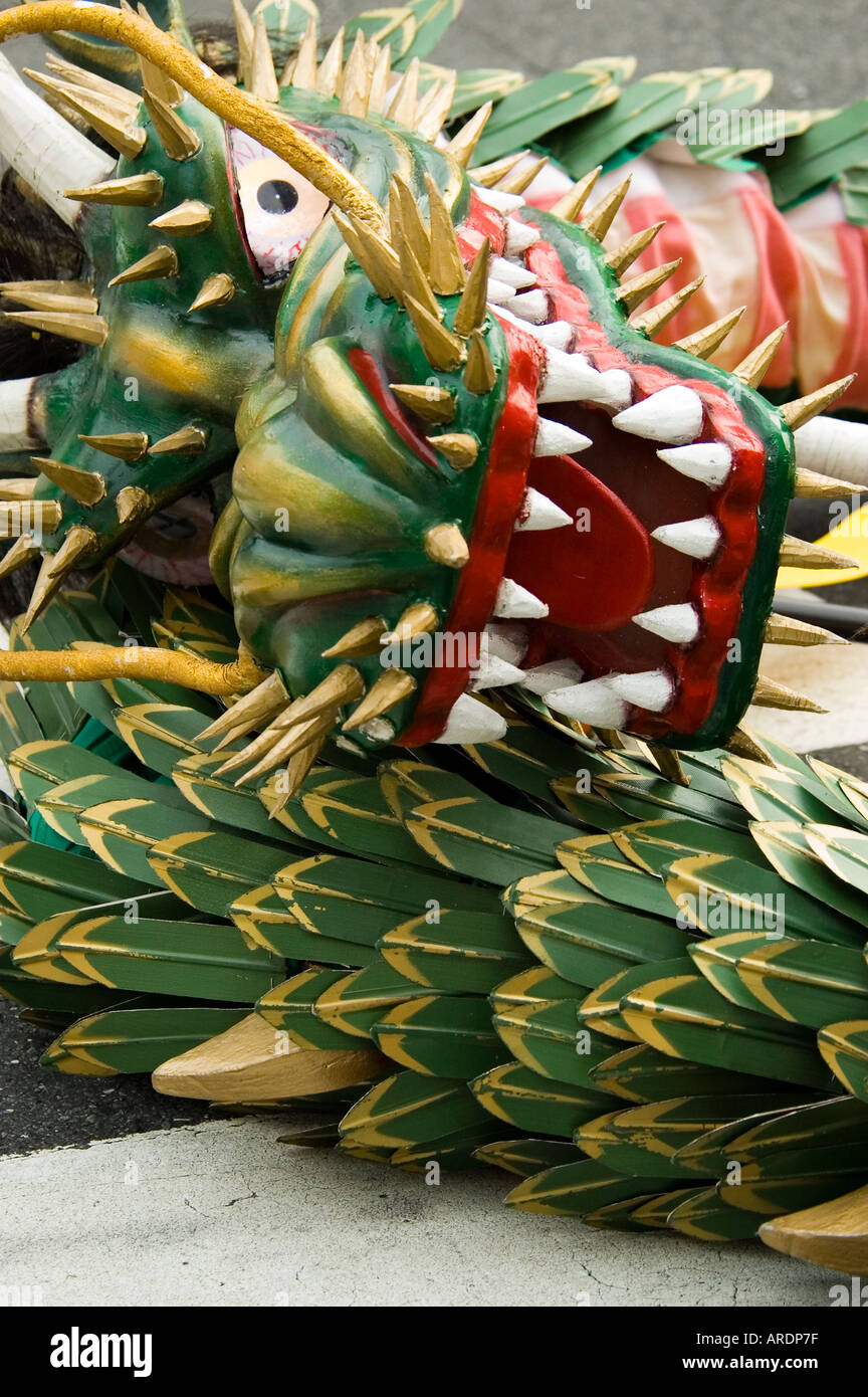 A Chinese dragon rests on the ground at a festival in Shinjuku Tokyo Japan Stock Photo