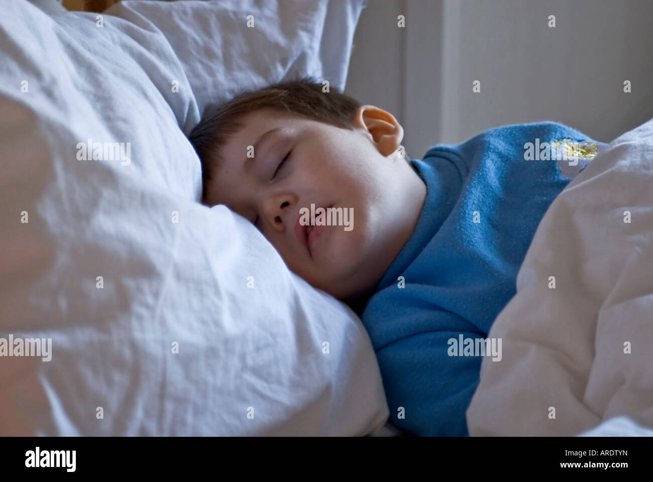Boy child sleeping bed Stock Photo