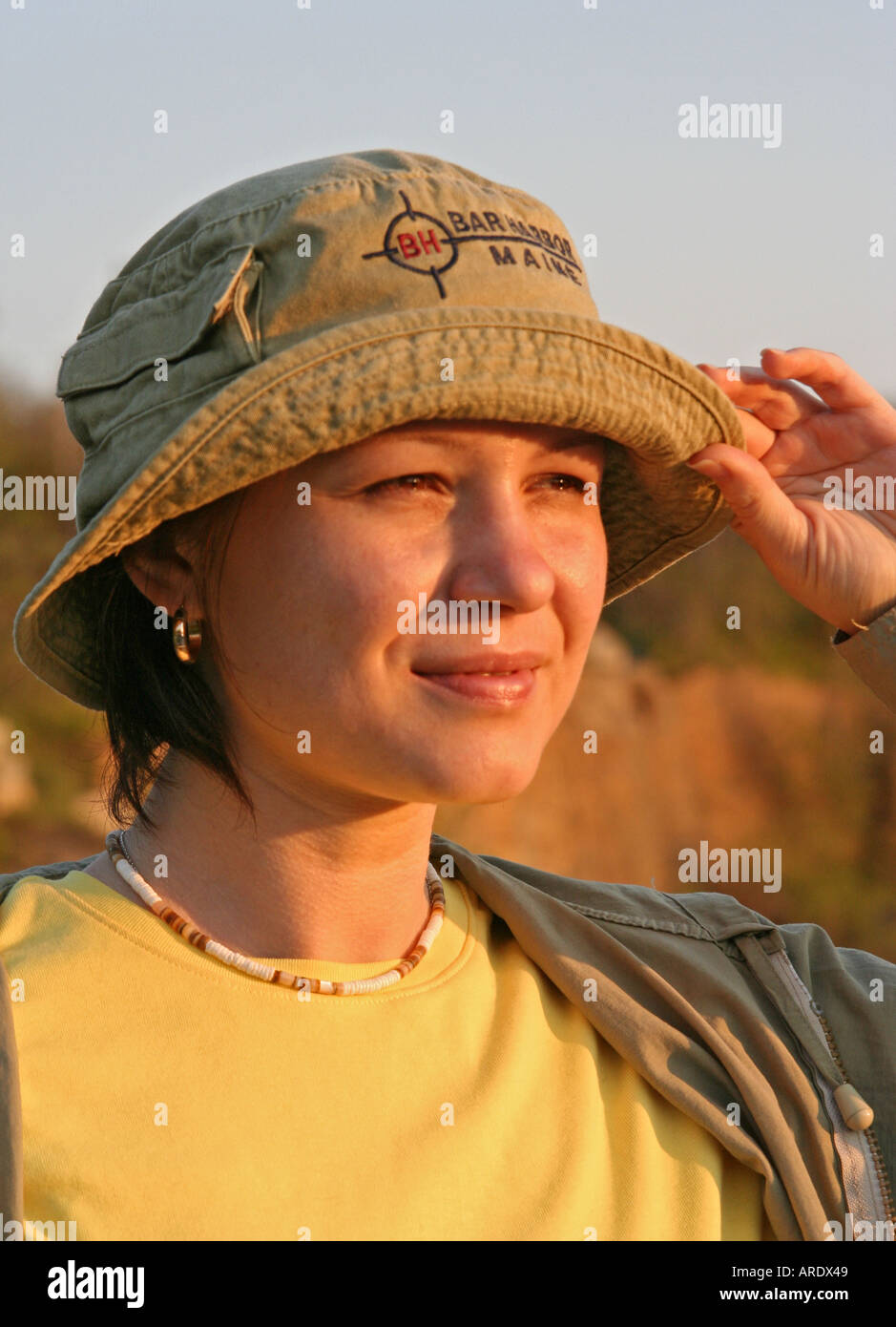 Head and shoulder outdoors portrait of young woman Sunset Rockport Halibut Point State Park Massachusetts Stock Photo