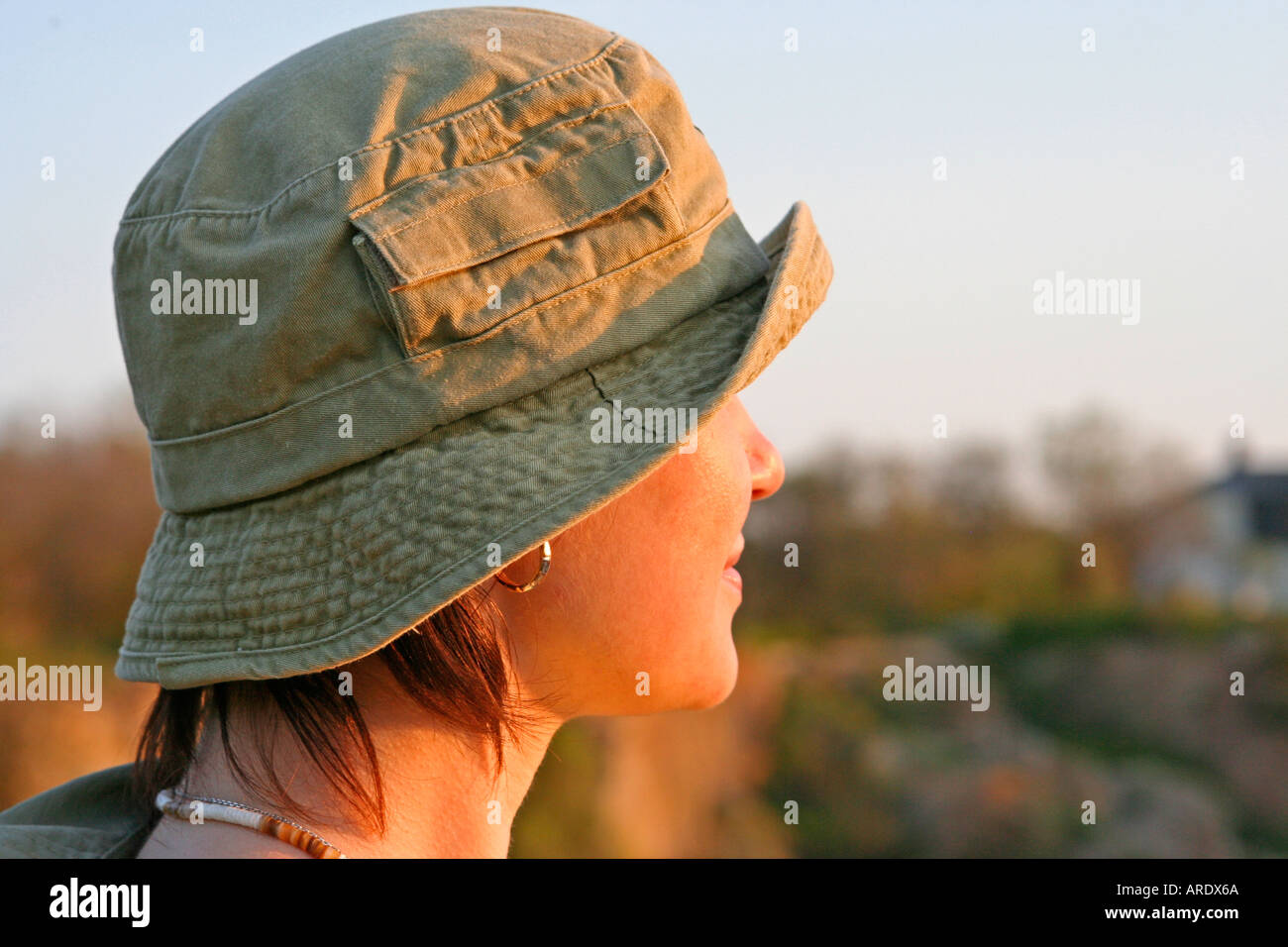 portrait of young woman in canvas hat Sunset Rockport Halibut Point State Park Massachusetts Stock Photo