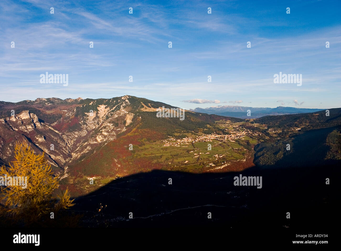 Panorama to folgaria with mountain in colours autumn and blue sky clouds Stock Photo