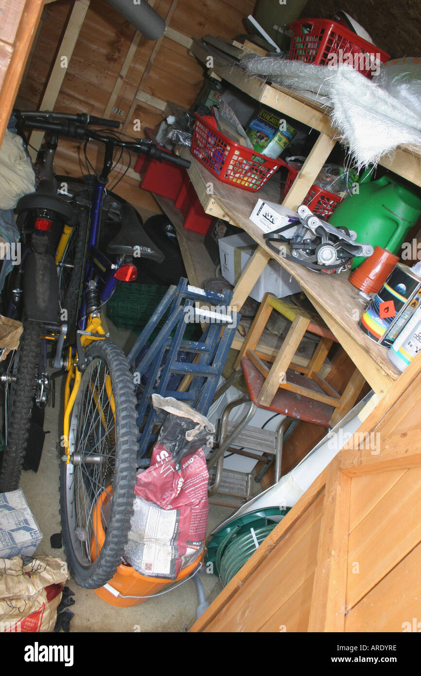 Cluttered, untidy garden shed Stock Photo