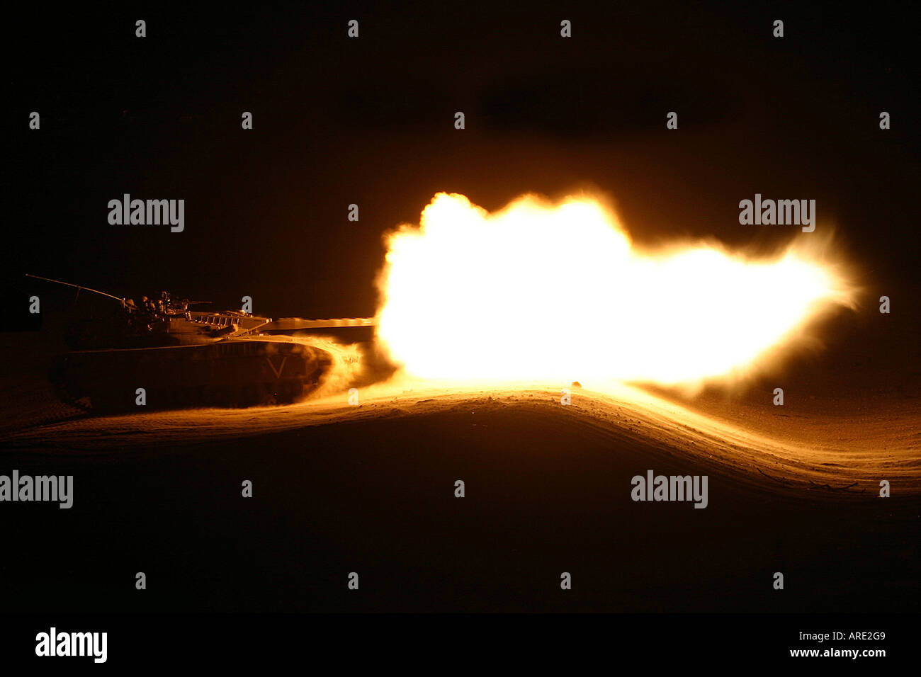 Golan Heights Israel Israeli Merkava tank firing a shell during night practice Stock Photo
